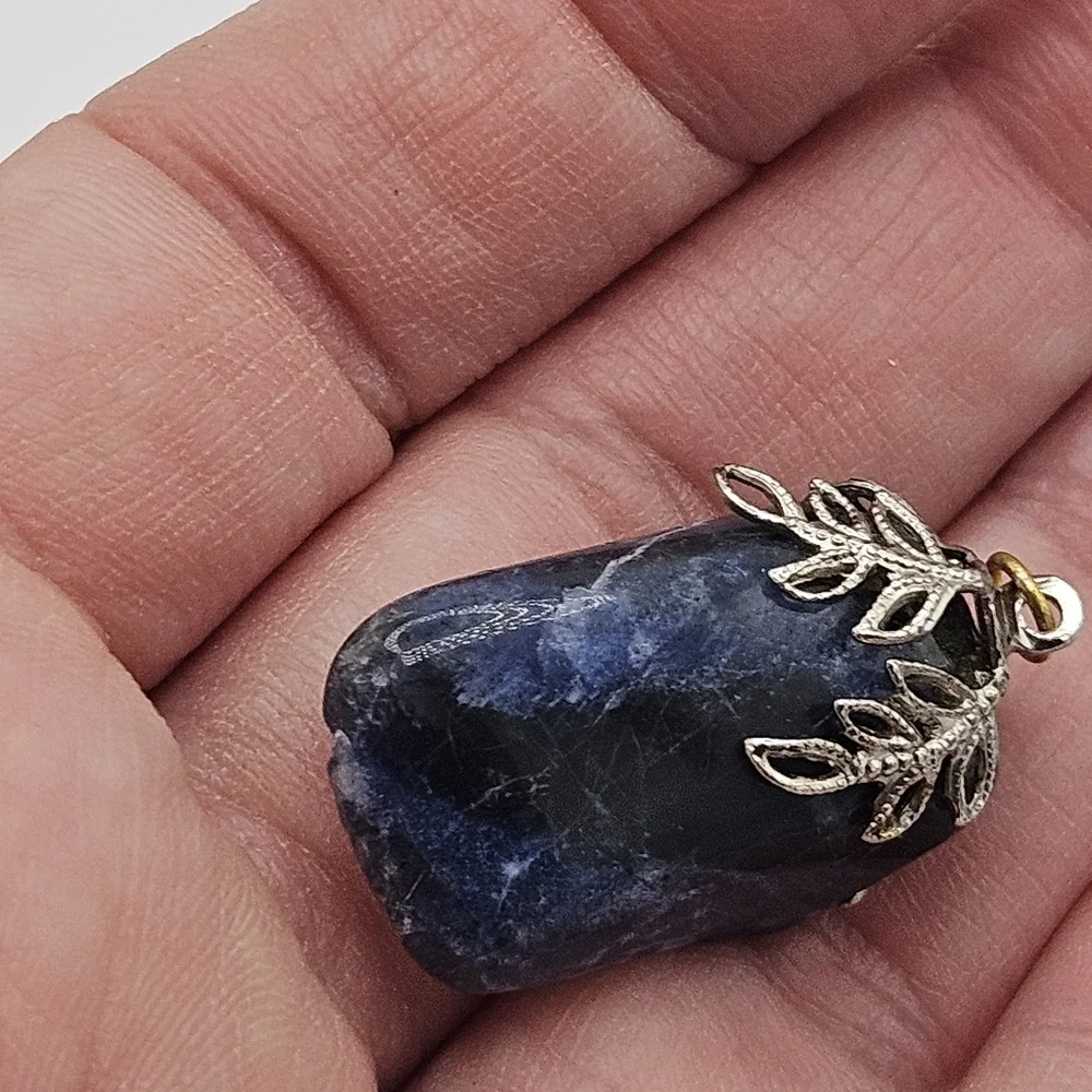 sodalite blue stone pendant with silver tone leafy bail